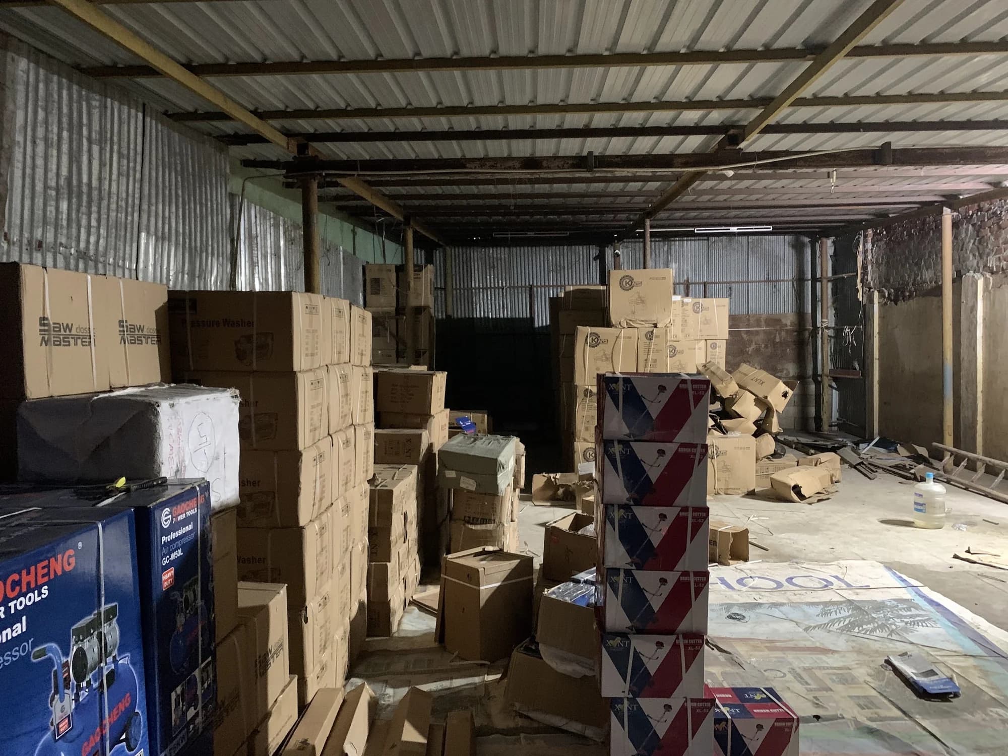 Falcor Power Tools warehouse storage shelves with boxed industrial machinery